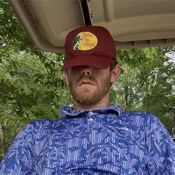 Kannapolis nudist golfer showing his club and balls