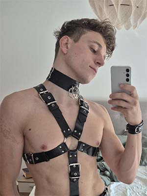 Caged submissive in leather harness in Little Rock, AR